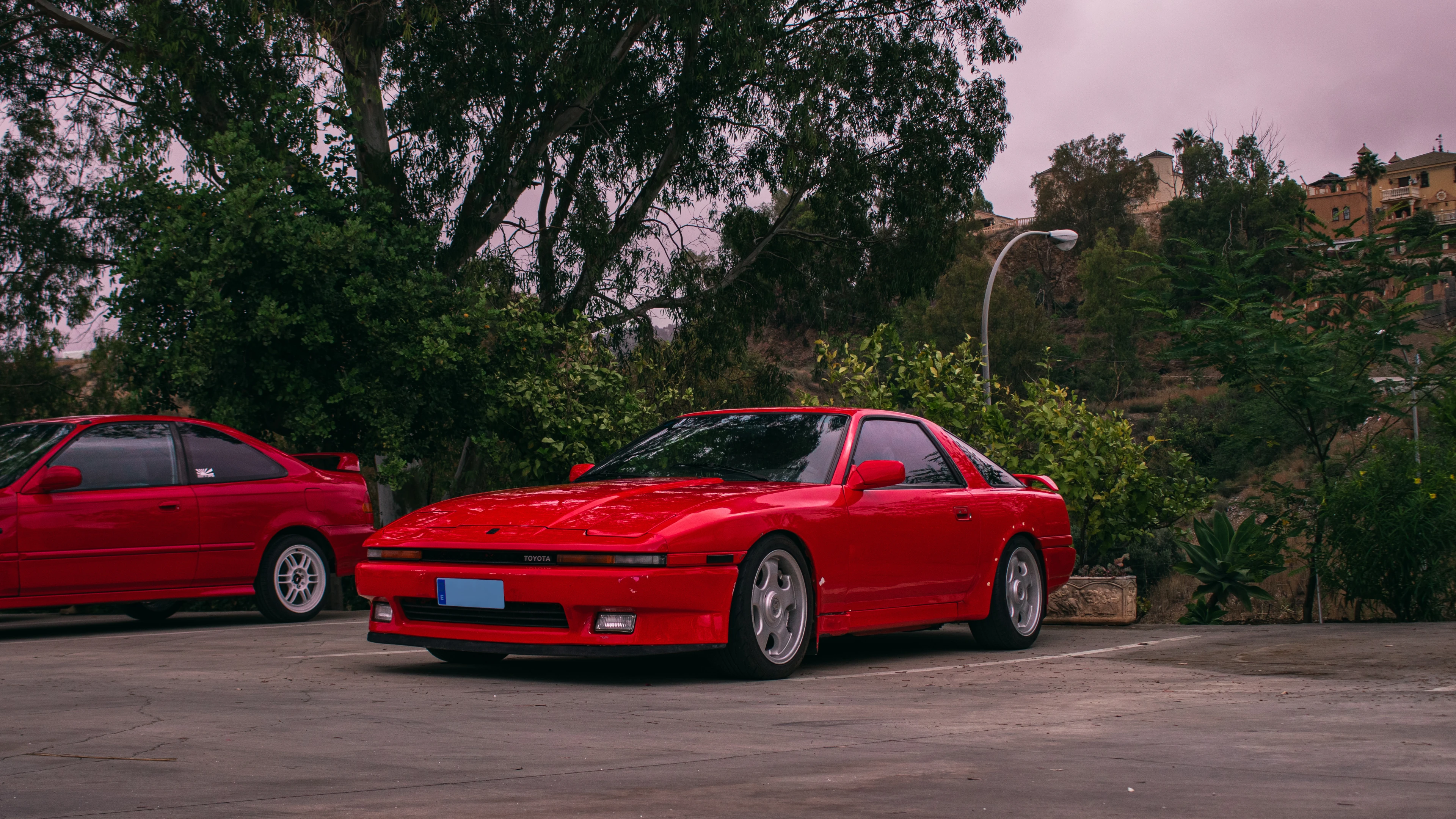 Big background image of a Toyota Supra mk3