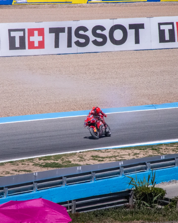 Marc Marquez recovering from a fall into the gravel